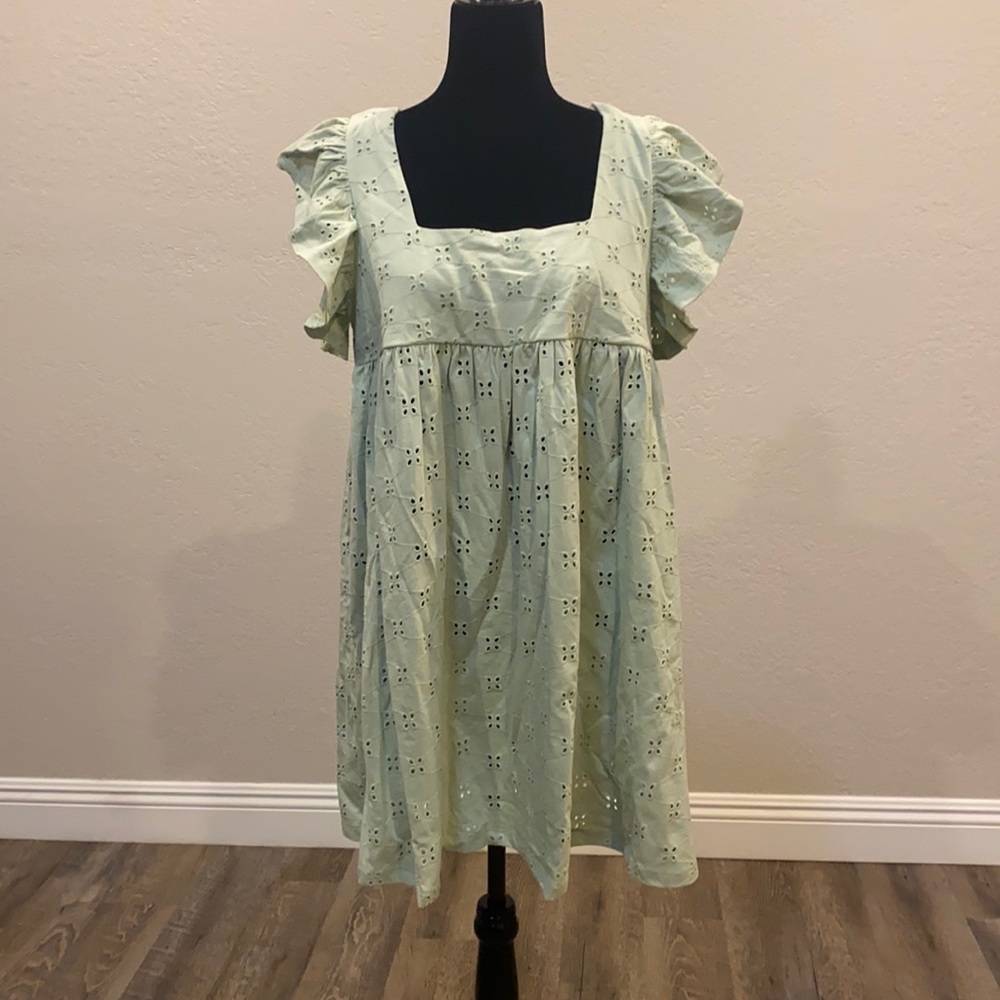 Sage Green ASOS DESIGN Broderick babydoll mini dress.
